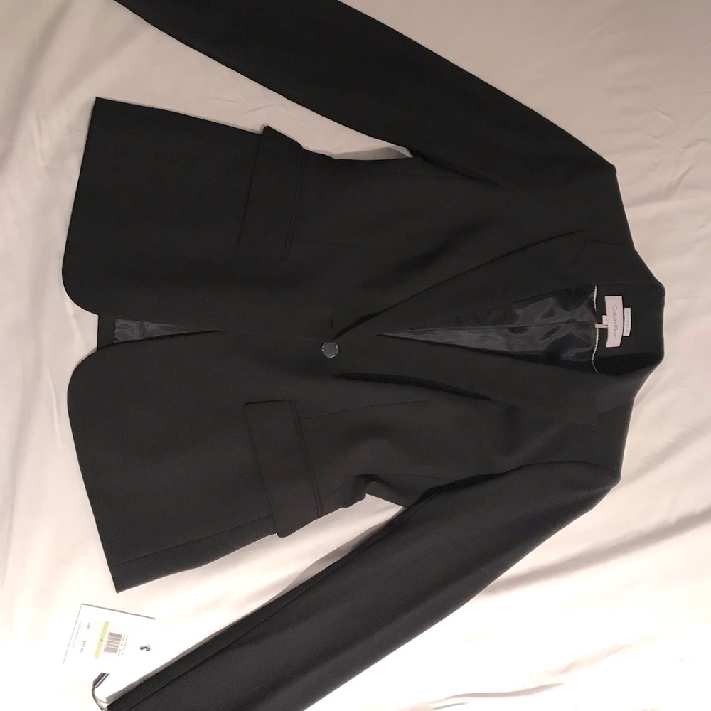 Calvin Klein black women’s suit. The blazer is a size 4 and the pants are an 8.